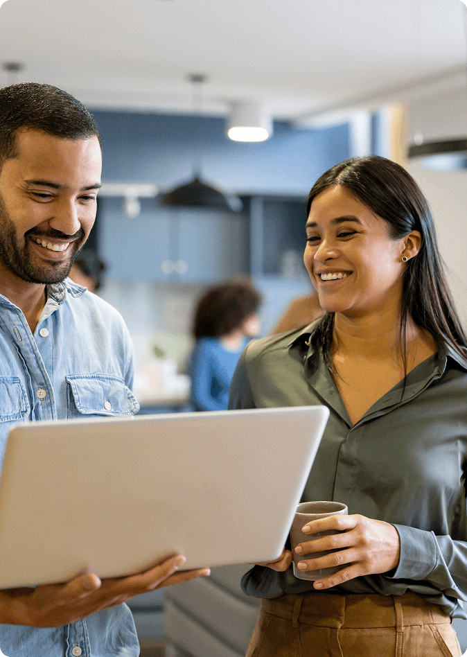 two-professionals-discussing-something-on-a-laptop